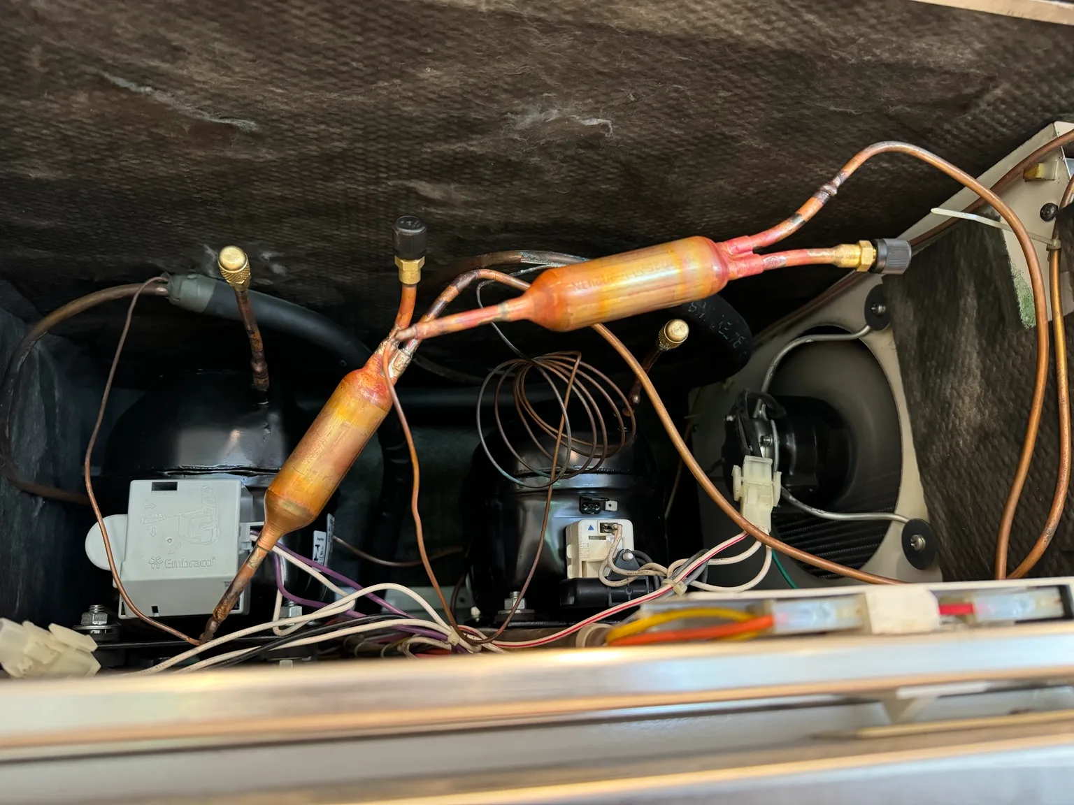 New Sub-Zero compressors and copper refrigeration tubing during installation